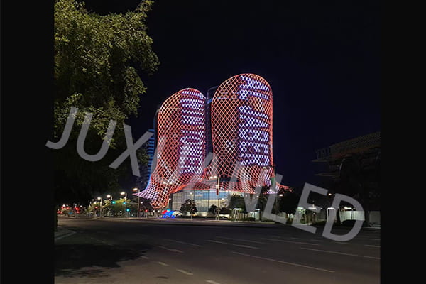 A beautifully lit modern building facade at night